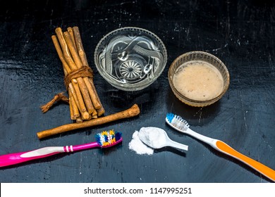 Close Up Of Best And Trusted Home Remedy For Tooth Problems And Yellow Teeth I.e. Baking Soda With Water And Normal Tooth Brush It Daily Thrice.All Ingredients On Wooden Surface With Neem Bark.