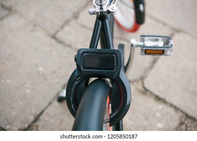 Close up of a bicycle coding system or lock. Lock code system is unlocked using a mobile phone.