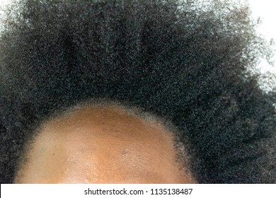 Close up of Black African American Woman's Kinky curly hair in natural state isolated on white background for Black healthy hair culture and Style stylish therapy professional treatment concept