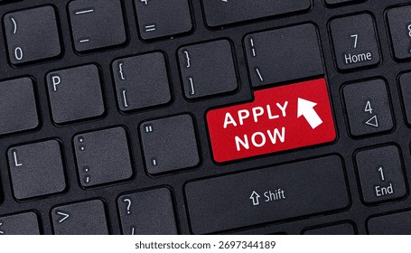 Close up of black computer keyboard featuring red apply now button for online job application recruitment and career opportunity concept