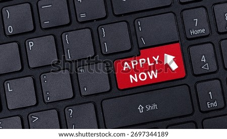 Close up of black computer keyboard featuring red apply now button for online job application recruitment and career opportunity concept
