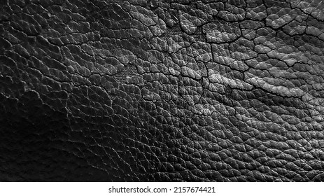 Close up black cracked leatherette texture