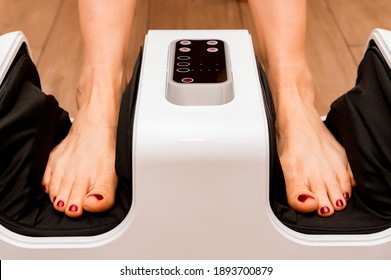 Close Up Of Black Foot Massage Device On Wood Floor