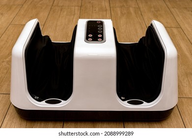 Close Up Of Black Foot Massage Device On Wood Floor