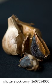 Close up of black garlic on black background