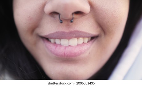 Close Up Of Black Girl Wearing Nose Septum Ring. Close Up Of Lips And Nose. Smiling Mixed Race Woman. Feminine Beauty.