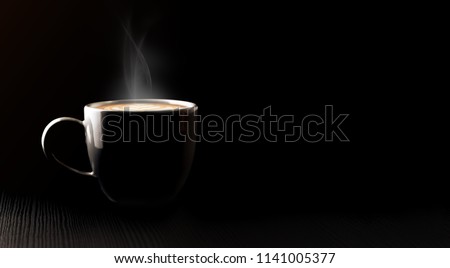 Close up black hot coffee cup and smoke with latte art foam on black wood table at cafe.dark scene.banner space mock up for adding text