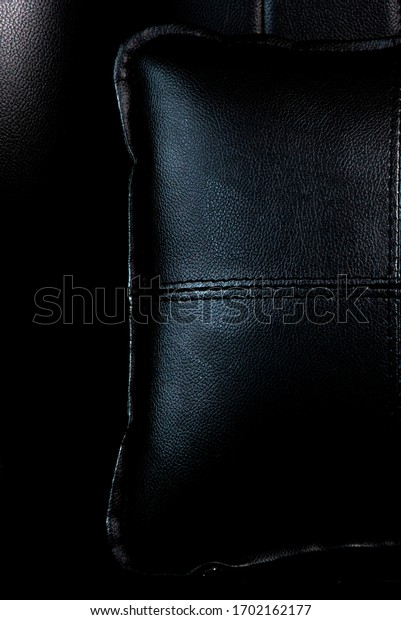 close up of a black\
leaher car seat cover