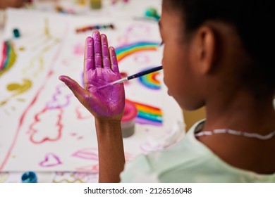 Close Up Of Black Little Girl Enjoying Finger Painting At Easter Party For Children, Copy Space