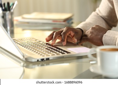 Close Up Of Black Man Hands Using Touchpad On Laptop On A Desk At Home