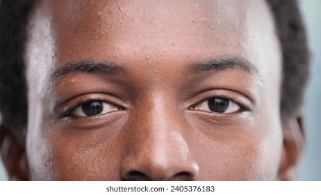 Close up of a Black man's face - Powered by Shutterstock