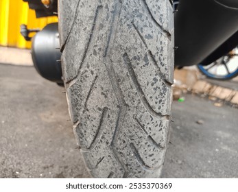 close up of black motorcycle rear wheel - Powered by Shutterstock