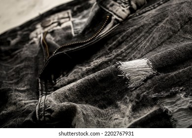 Close Up Of A Black Ripped Jeans