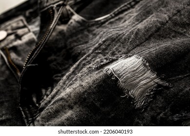 Close Up Of A Black Ripped Jeans