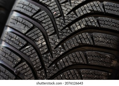 Close Up Black Rubber Winter Tire Texture.buying New Tires For Season Winter Replacement.little Dirty Surface. Winter Protector. Slippery Road Snow Ice.auto Service Concept