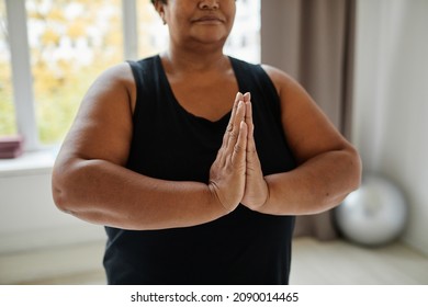 Close Up Of Black Senior Woman Meditating While Doing Yoga Indoors, Focus On Hands In Balance