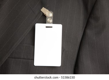 close up of black suit with id card - Powered by Shutterstock