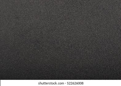 Close up of black textured plastic background