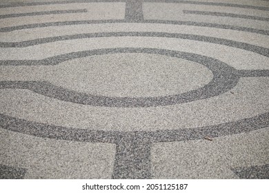 Close Up Of Black And White Circle Pattern On Tarmac. Black And White Circles In England.