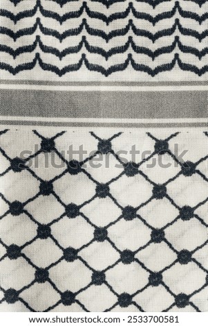 close up of black and white fishnet pattern on Keffiyeh, Kaffiyeh, Kuffiyeh, Shemagh scarf