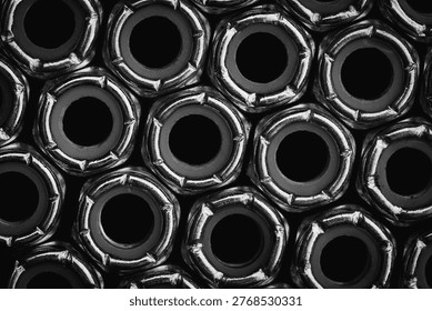 Close up black and white industrial pattern of locking nuts