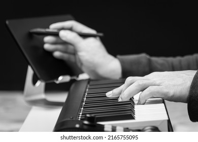 Close Up Black And White Male Songwriter Hands Writing A Hit Song With Midi Keyboard. Songwriting Concept