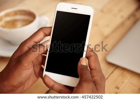 Similar – Image, Stock Photo Hand holding coffee, woman drinking in background