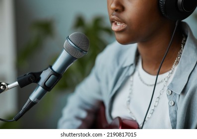 Close Up Of Black Young Woman Singing To Microphone And Recording Songs At Home, Copy Space