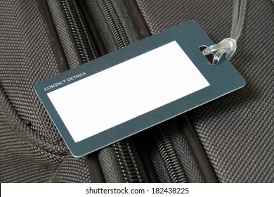 Close Up Of Blank Luggage Tag On Suitcase