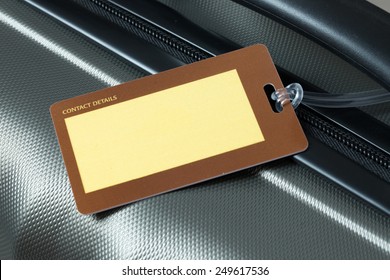 Close Up Of Blank Luggage Tag On Suitcase