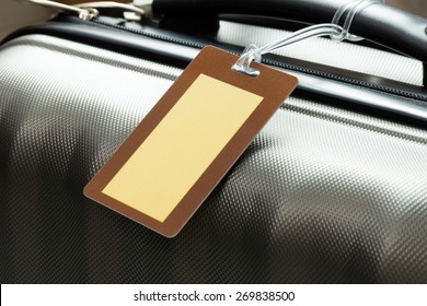 Close Up Of Blank Luggage Tag On Suitcase