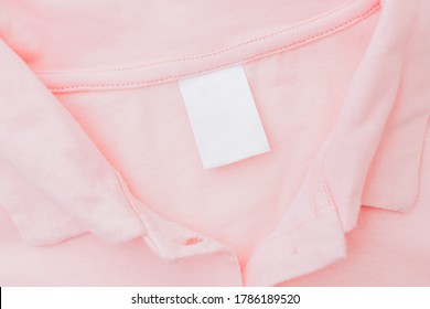 Close Up Blank White Label On A Pink T-shirt