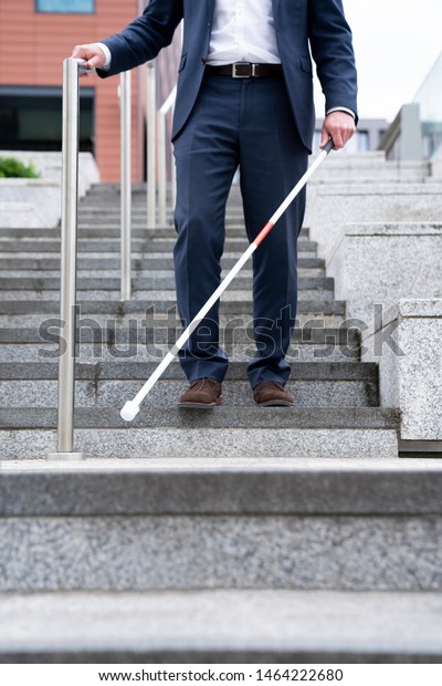 Close Up Of Blind Person Negotiating Steps Outdoors\
Using Cane