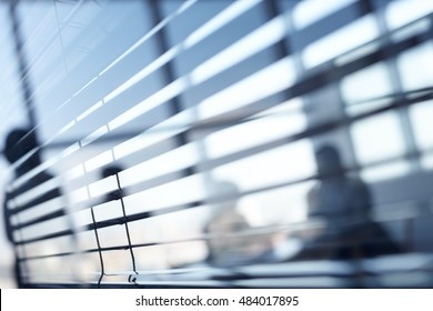 Close Up Of Blinds In Dark Office