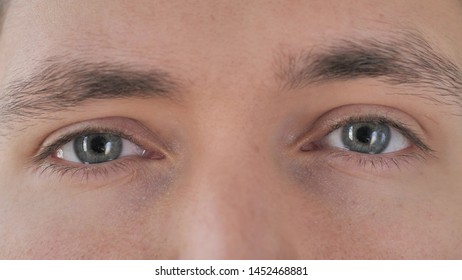 Close Up of Blinking Eyes of Young Man