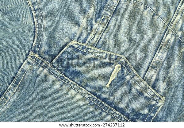 close up of a blue denim jacket with pocket,\
unbuttoned, macro, detail, full frame, slanted, tilt, horizontal /\
Denim Jacket, Detail,\
horizontal