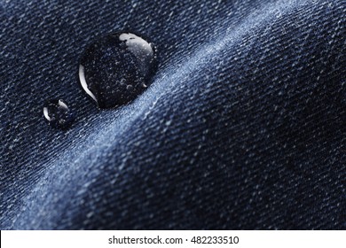 Close Up Of Blue Denim With Water Drop