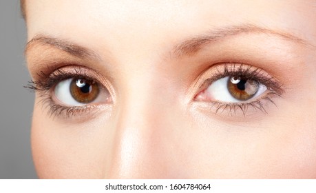 Close Up Blue Eye With Natural Makeup Looking At The Side, Macro Shot With Perfect Skin