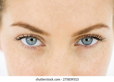 Close up of the blue eyes of a young woman.