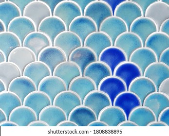 close up blue fish scales wall tile with random tone of blue, cyan and white color. mermaid and under water concept background. - Powered by Shutterstock