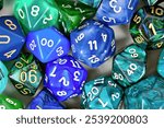 Close up of blue and green roleplaying game RPG dice 