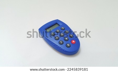 Close up of blue internet banking token used to generate passwords for online transactions on white background.