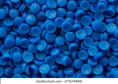 Close up of Blue plastic. plastic polymer granules, Raw materials for making water pipes, Plastics from petrochemicals and compound extrusion, resin from plant polyethylene.