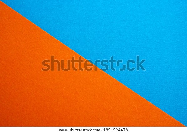 Close up of\
a blue suede and orange divided by half the ratio of the textured\
background,the separation of\
tissues