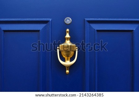 Close up of blue wooden door of home with eyehole . High quality photo