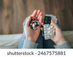 Close up blurred background in unrecognizable human hand pills, tablets, round, oval, elongated shape. Concept of health care. Medications. Girl takes a lot of vitamins and minerals.