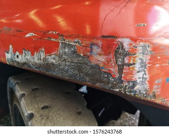 Up Close A Body Parts Of Forklift Edge Rusted, Scratched, Peeled And Damaged With Selective Focus. Damage Concept. 