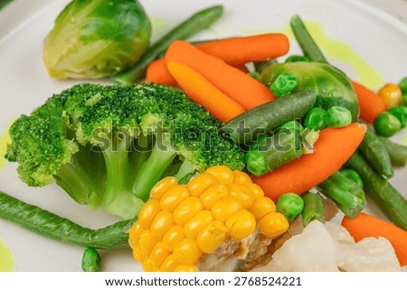 Close up of boiled mixed vegetables broccoli carrot beans and corn, healthy diet food, vegetarian meal, clean eating concept