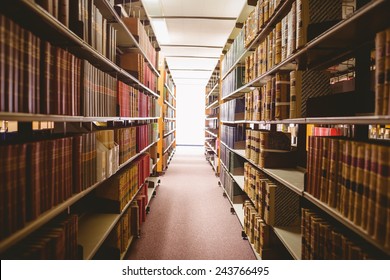 Close up of a bookshelf in library Stock Photo