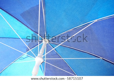 Close up bottom view of a blue umbrella